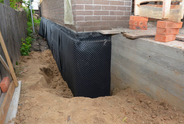 Happy homeowners after waterproofing job in Colden